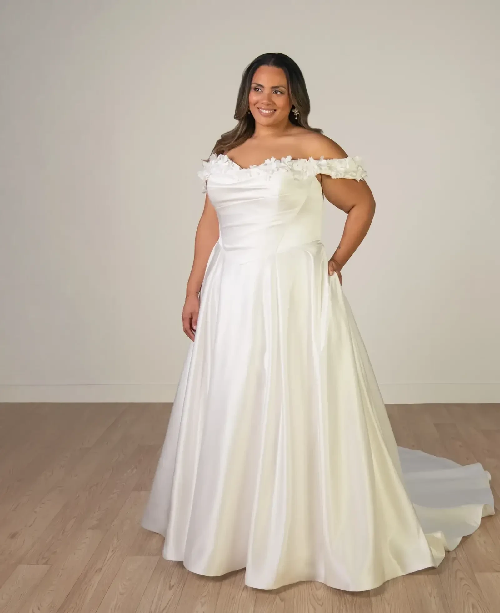 Model wearing a plus size gown by Stella York - Ever Body Every Bride