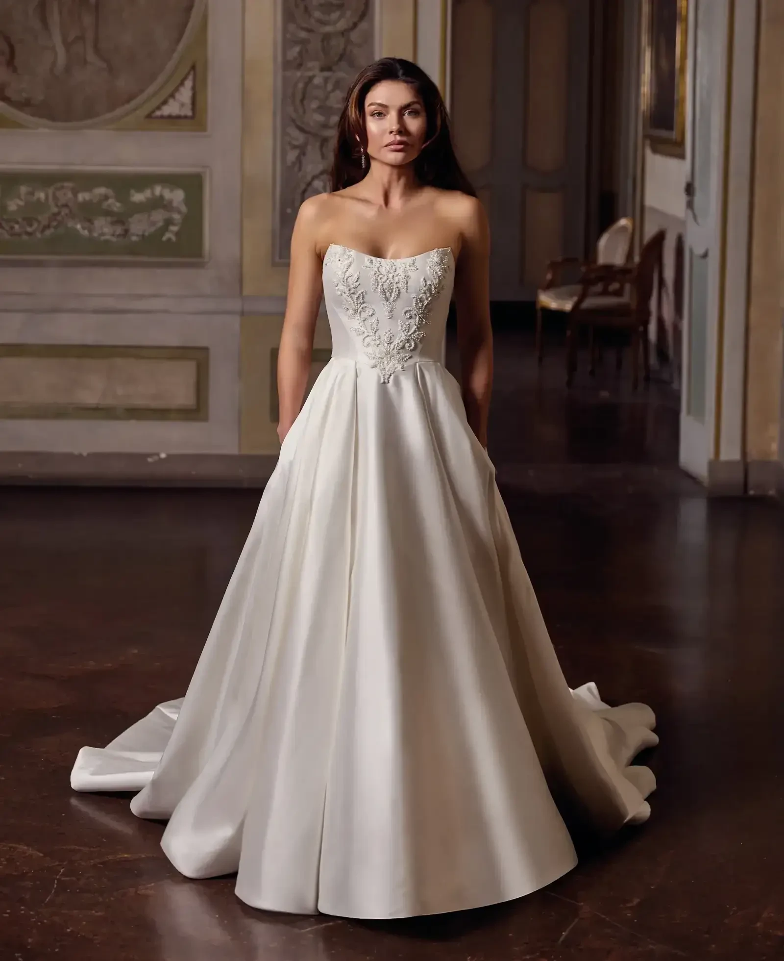 Model wearing a gown by Eddy K Milano Couture