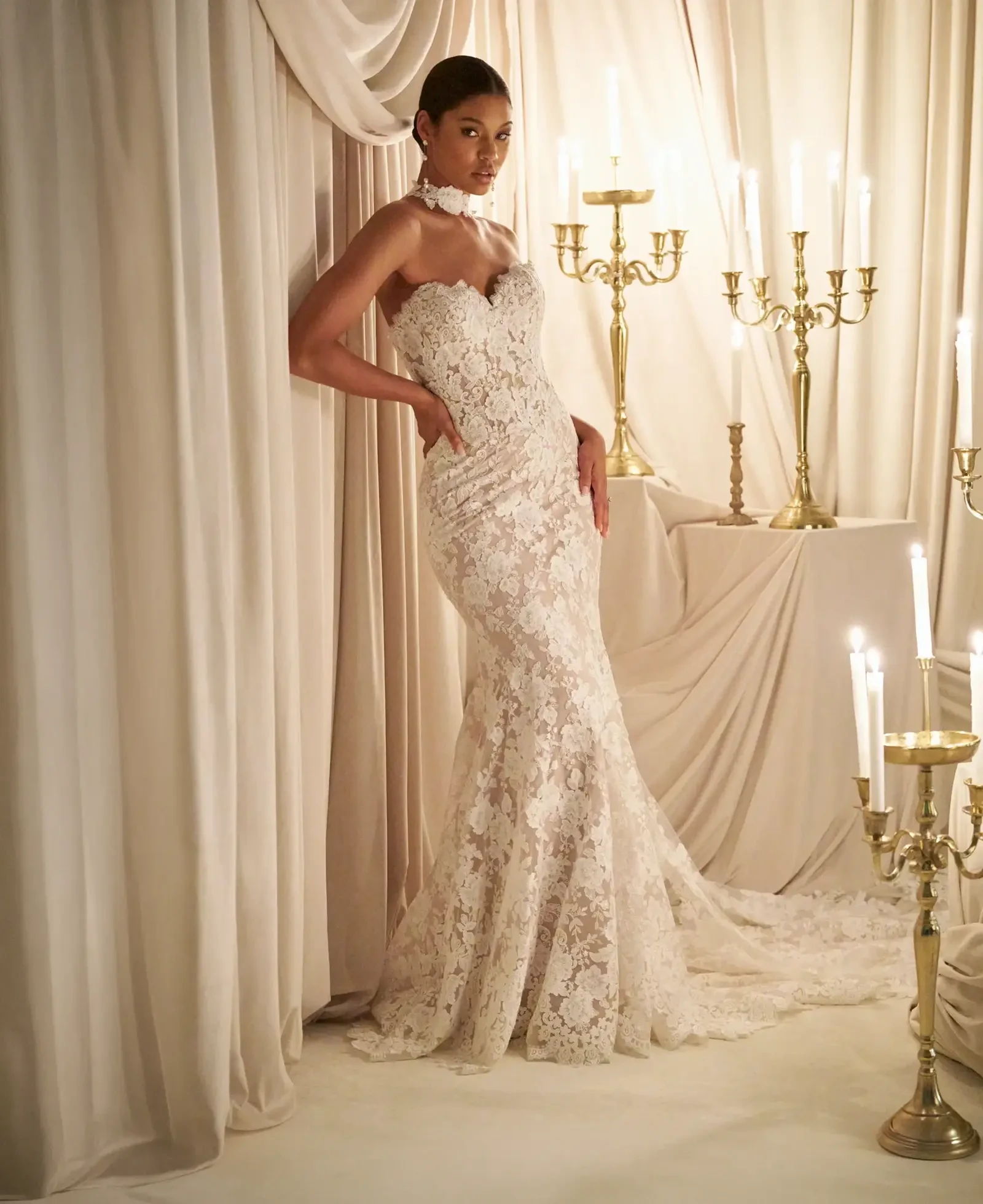 Model wearing a gown by Allure Couture