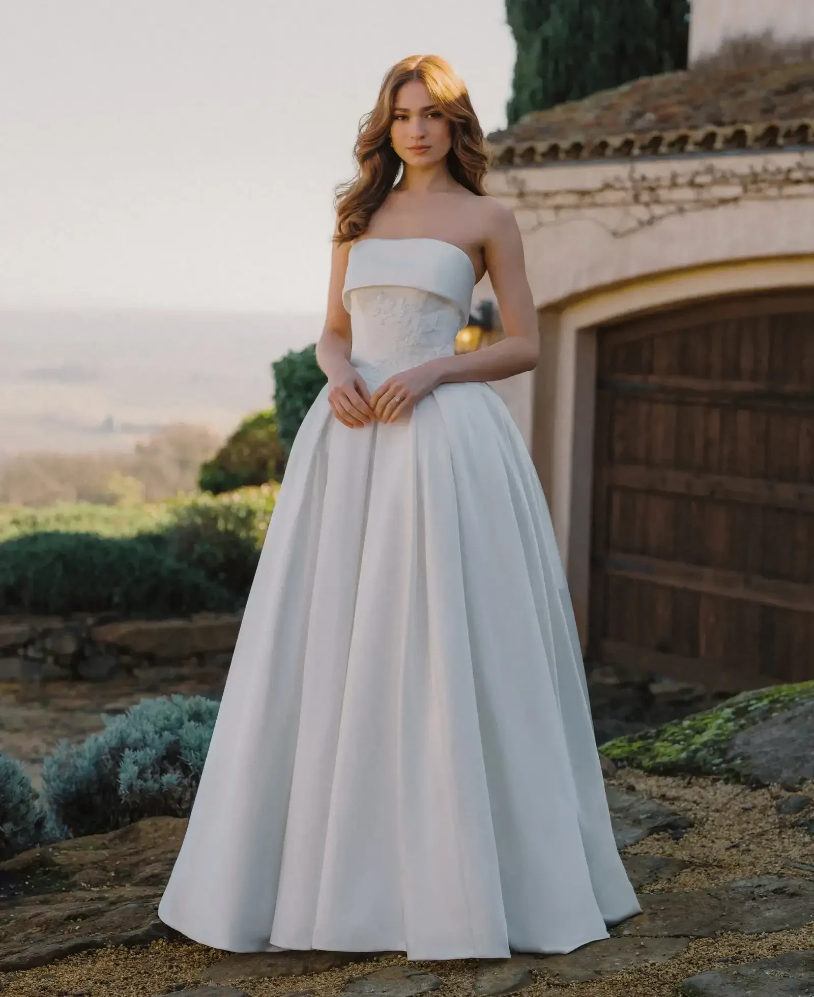 Model wearing a gown by Allure Bridals
