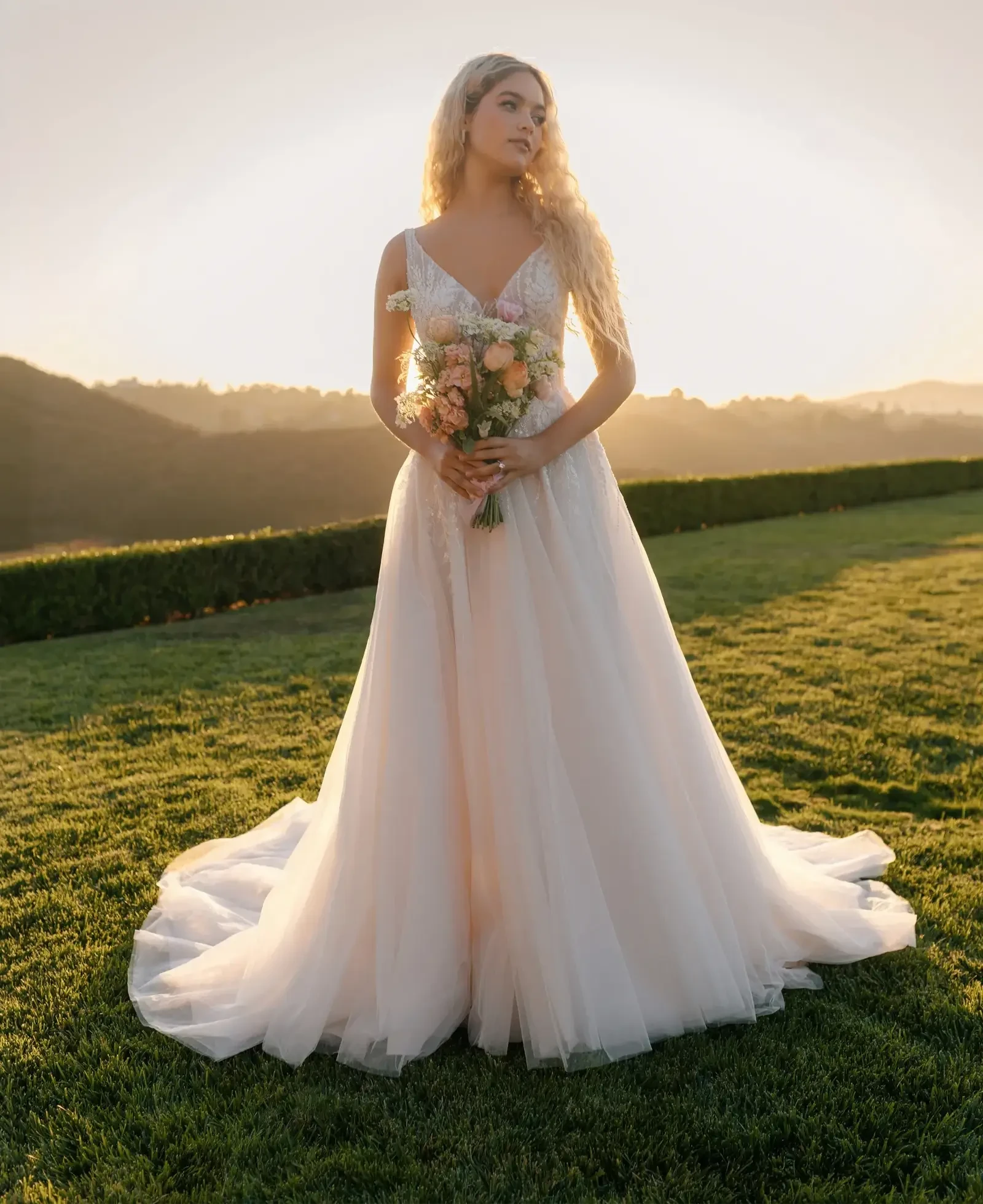 Model wearing a gown by Allure Romance