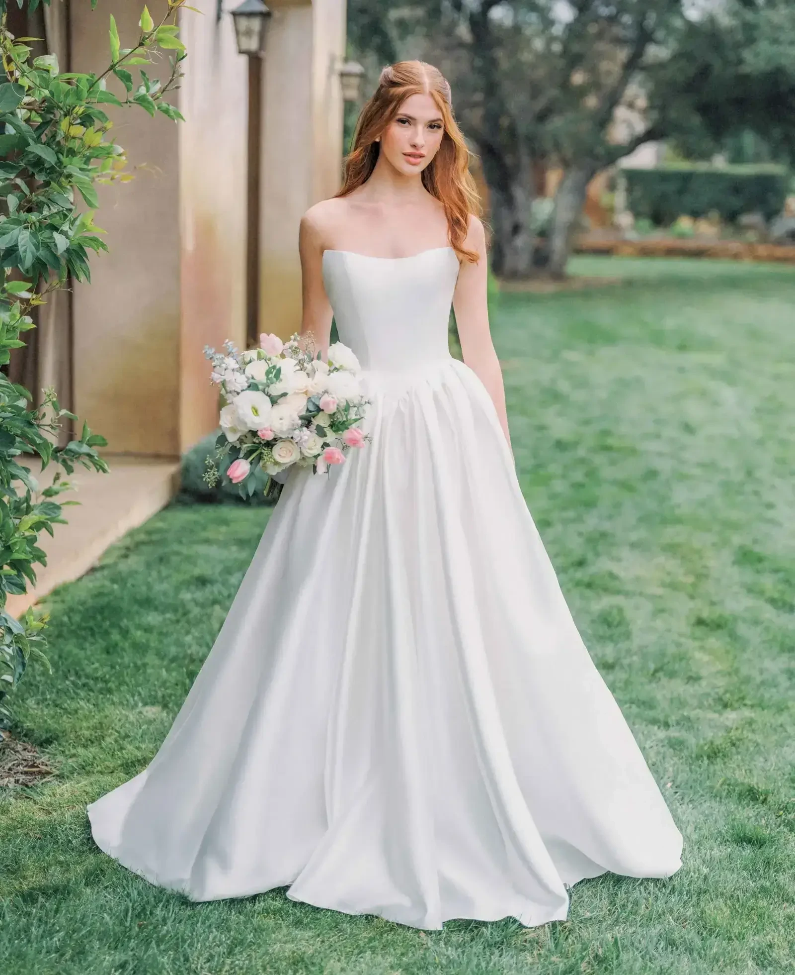 Model wearing a gown by Allure Romance