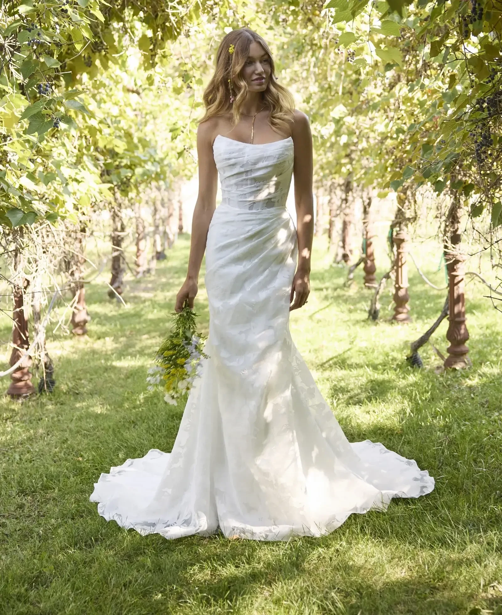 Model wearing a gown by Rebecca Ingram