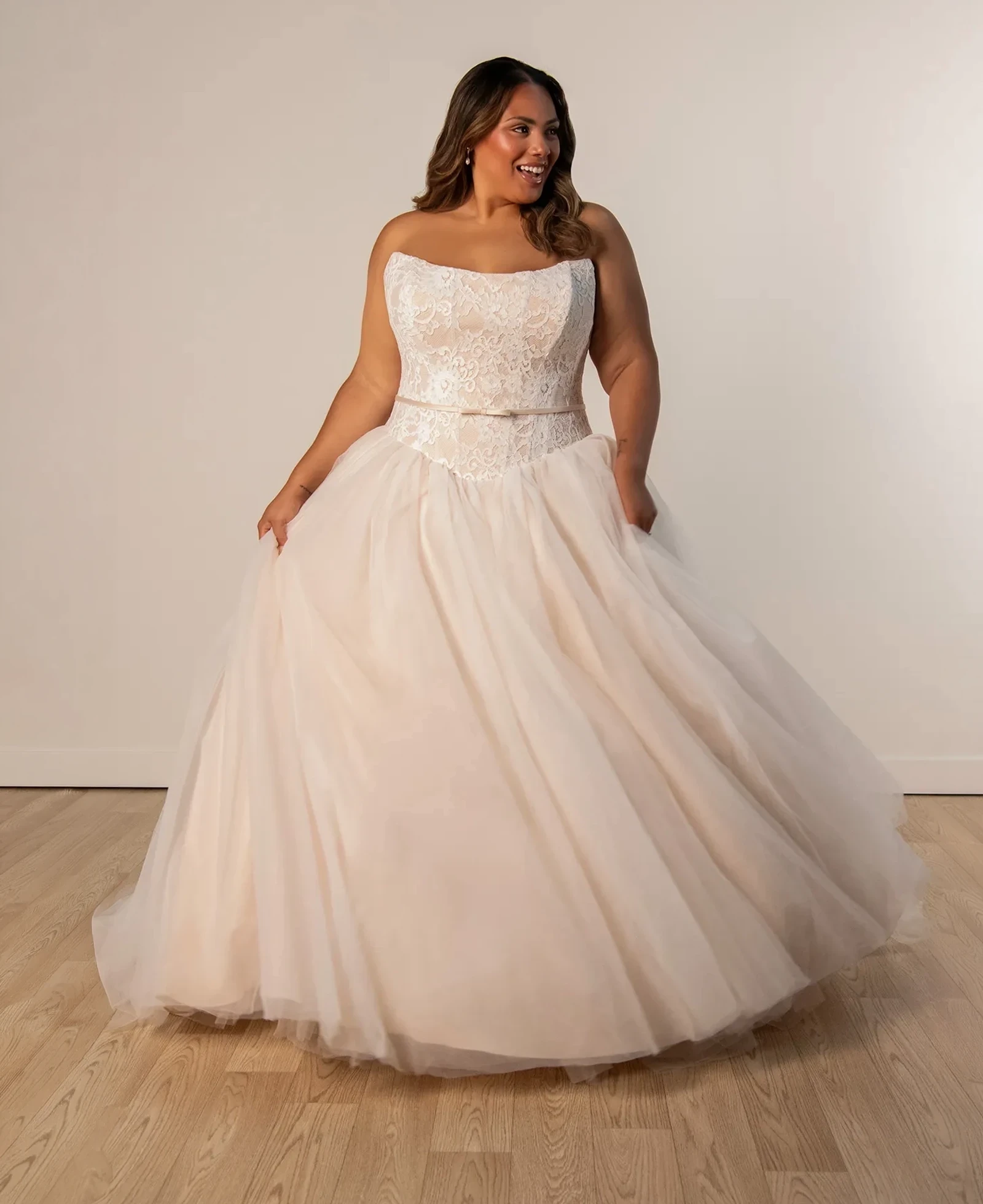 Model wearing a plus size gown by Stella York - Ever Body Every Bride