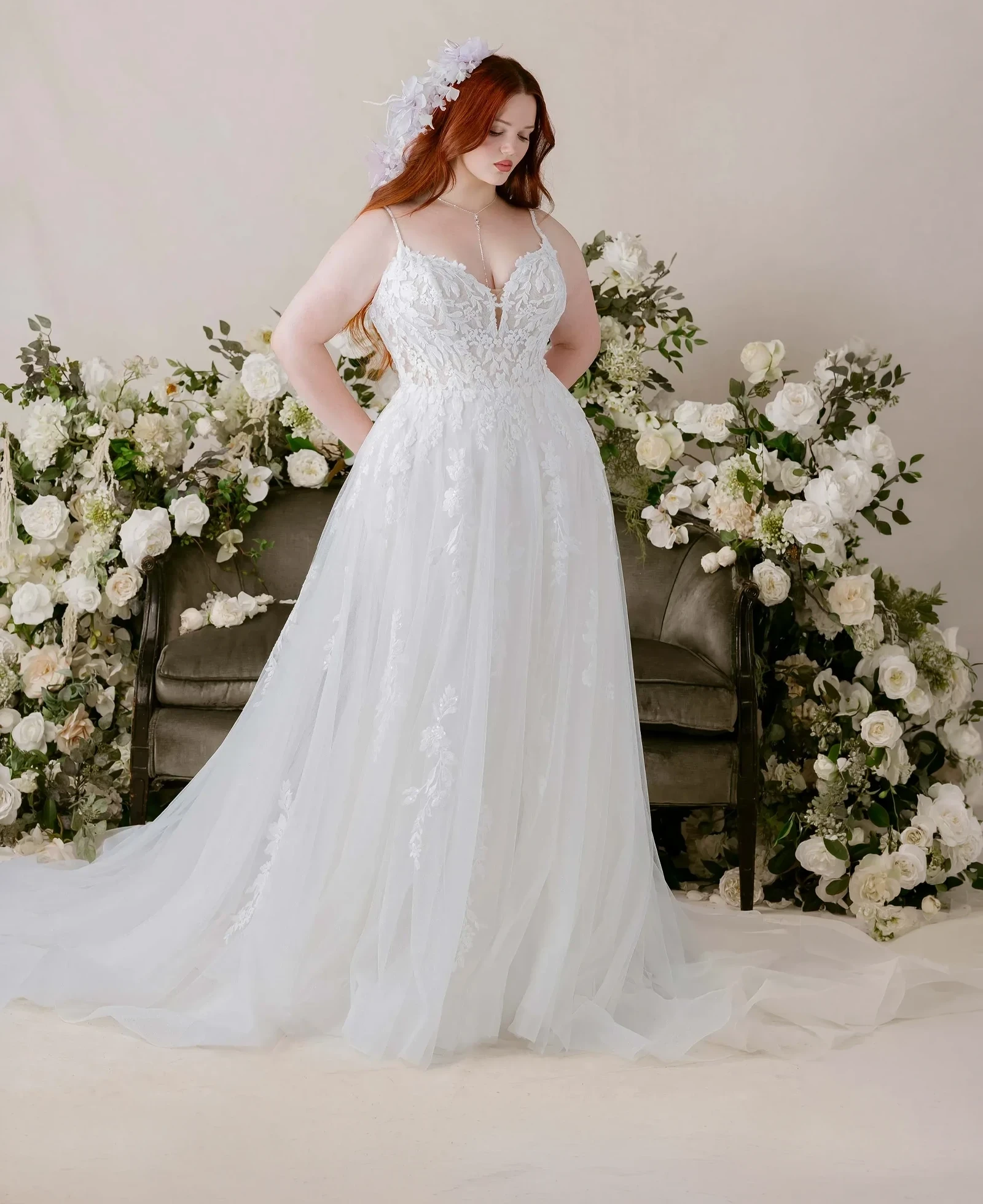 Model wearing a plus size gown by Julietta by Morilee