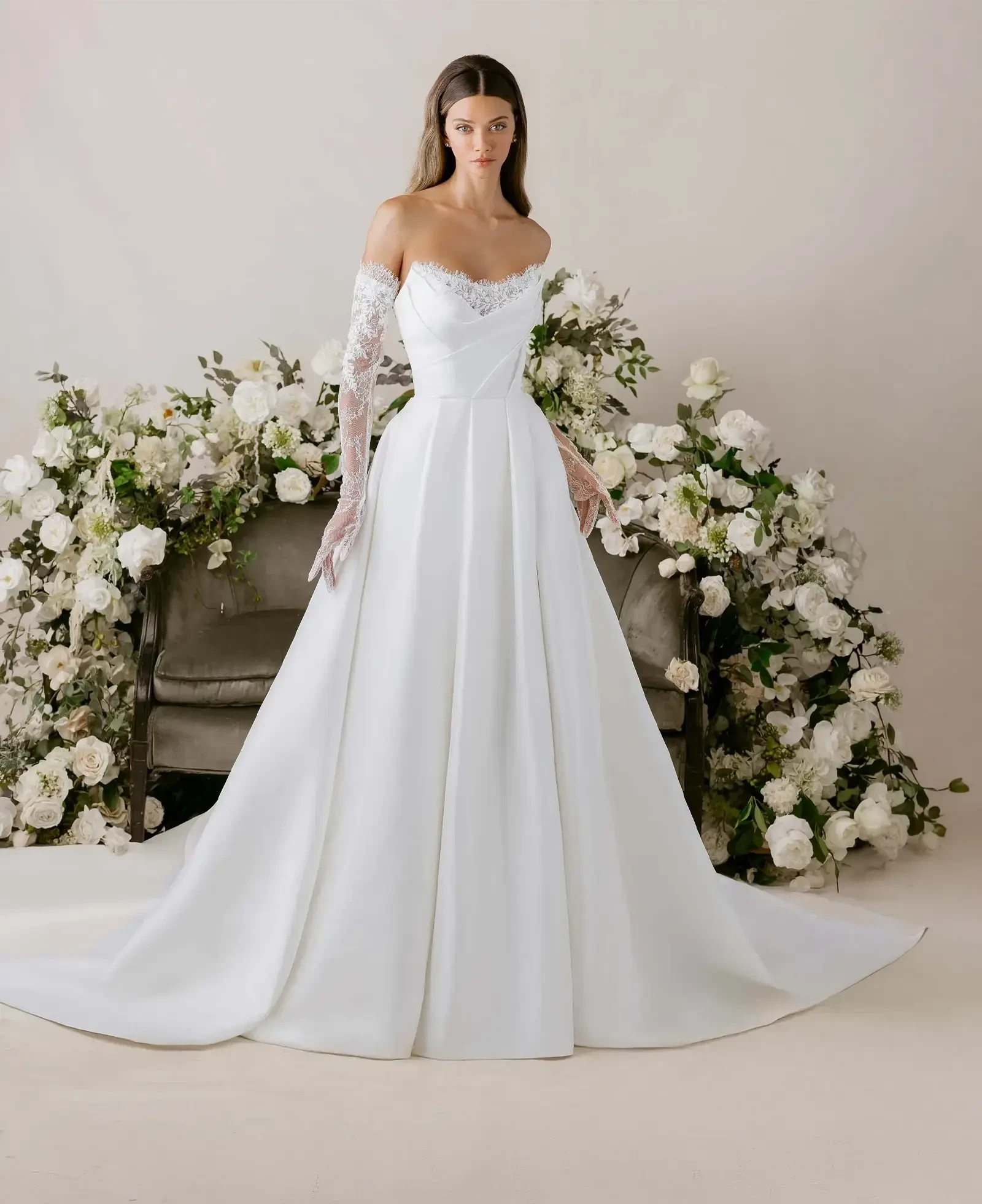 Model wearing a gown by Morilee